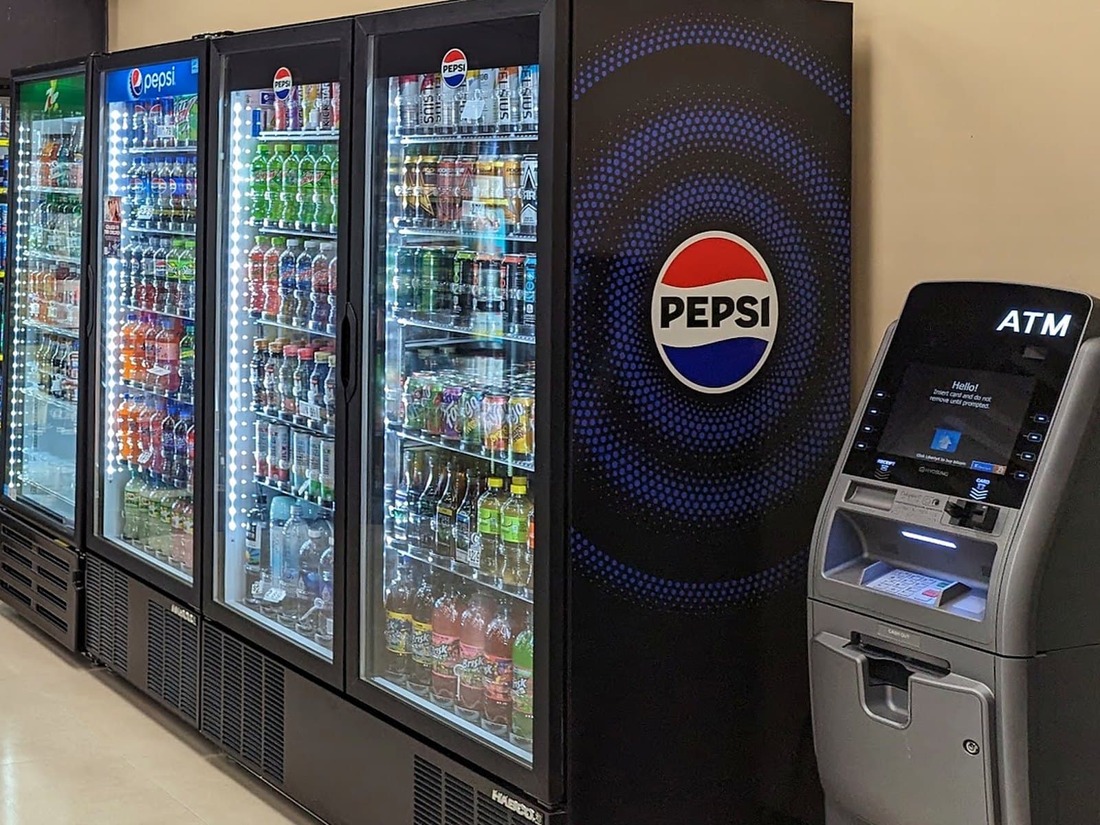 Pepsi coolers and the ATM inside the store